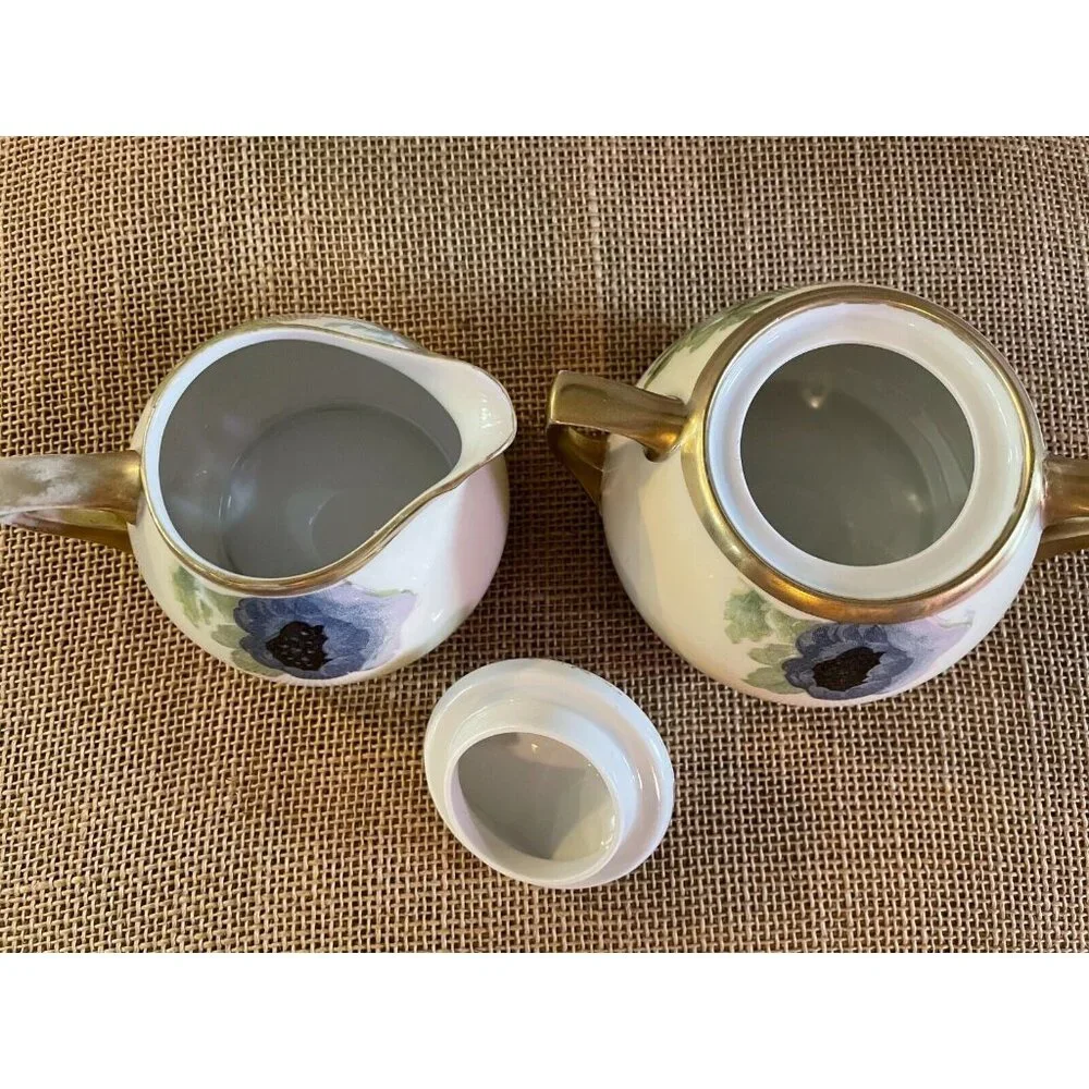 D & E.G. Royal Austria Handpainted Artist Signed Purple Floral Creamer & Sugar